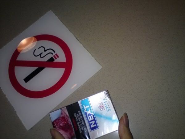 No smoking sign and cigarette box
